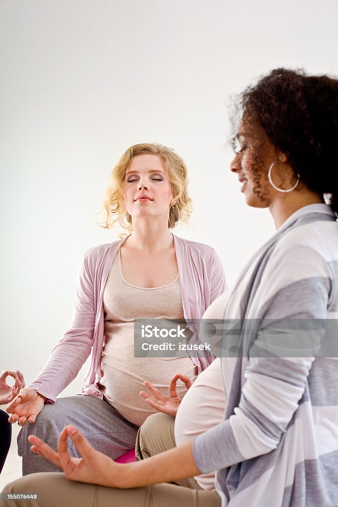 Pregnant women doing yoga  20-24 Years Stock Photo