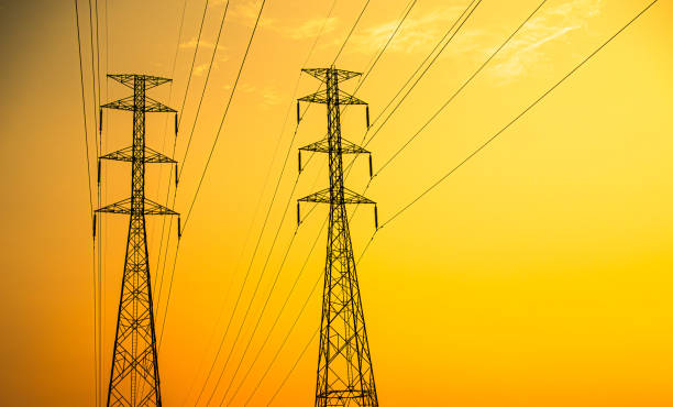 istock High voltage pole on Sunset Background, Line Power Utility Tower Electric Voltage Transmission Energy Station Distribution, Electrician Grid Post Tower Danger Technology Construction Industry 1550764913