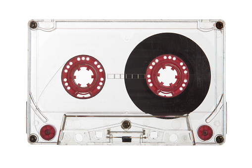 Old retro transparent cassette tape. Vintage 80's music tape isolated on white background