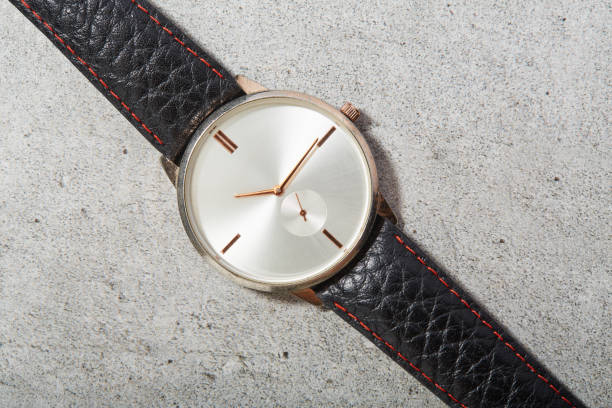 A man watch on the wooden table, shallow focus.