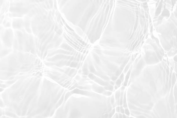 istock White water with ripples on the surface. Defocus blurred transparent white colored clear calm water surface texture with splashes and bubbles. Water waves with shining pattern texture background. 1550823639