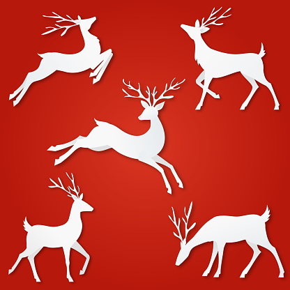 A cute seasonal cut paper reindeer set design on a red background.