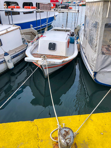 Reflection of wooden fisherman boat in Bodrum Harbor
