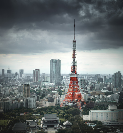 Tokyo Tower in front of ominous clouds.