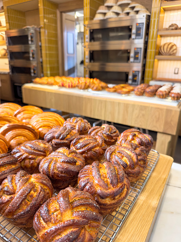 Freshly baked pastries in a row in a bakery
