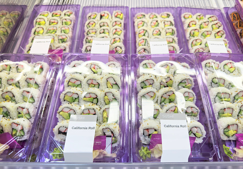 Fresh sushi boxes in a market retail display