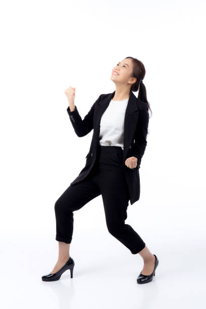 Portrait beautiful businesswoman in suit glad and success isolated on white background, happy young asian business woman is manager or executive surprise and excited for victory with satisfied. stock photo