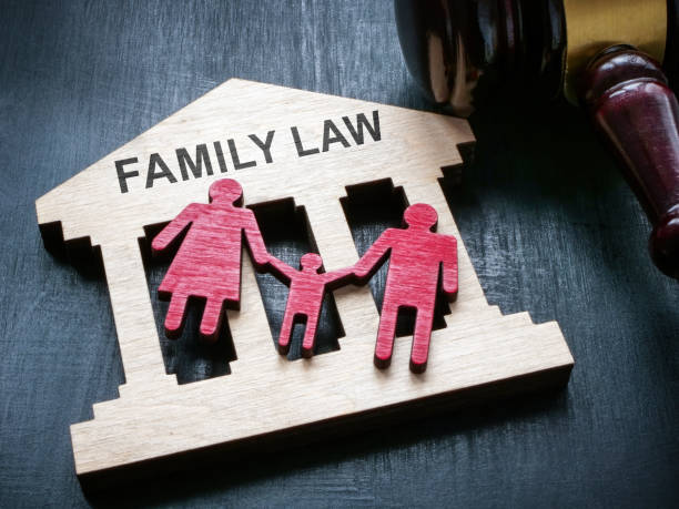 Plate with sign family law, figurines and gavel. stock photo