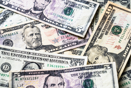 Close-up of a background of different US banknotes.