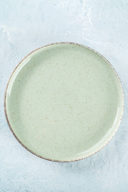 istock An empty green plate, top shot on a slate background 1550915764