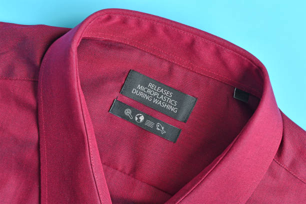 istock Shirt with label saying 'Releases microplastics during washing' 1550925783