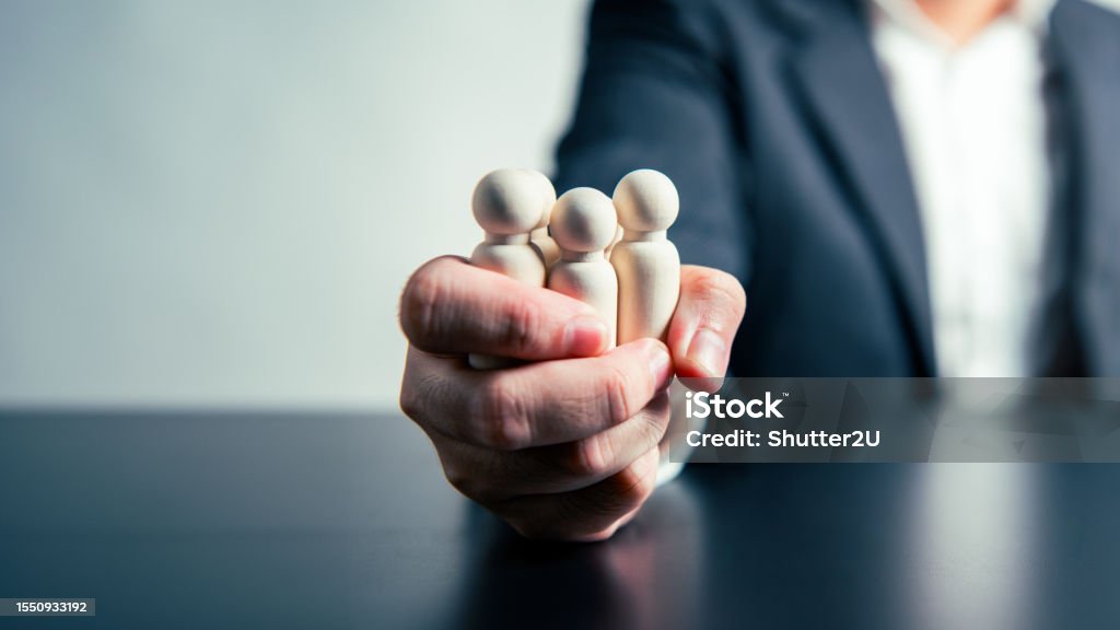 CEO Influence  Business Agreements and Employee Dismissals workforce labor businessman hand background. Tyrant and corruption concept. Authority Stock Photo