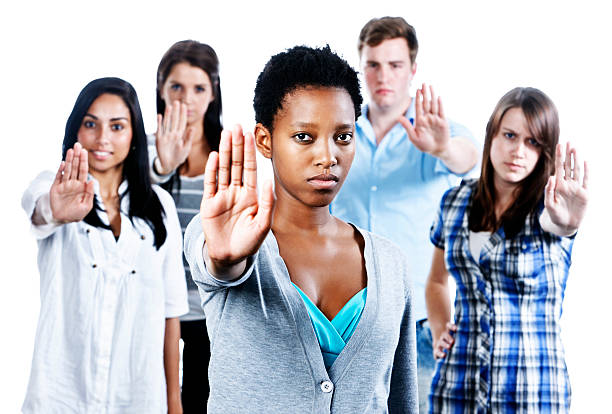 istock Five serious young people indicate "Stop"  holding up their hands 155095082