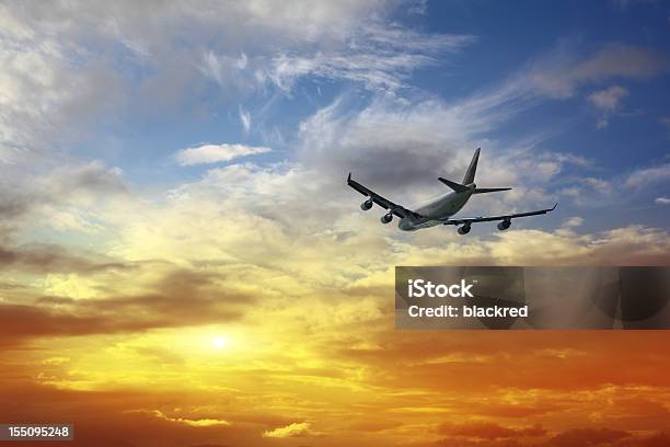 Airplane Flying Into Sunset Sky Stock Photo - Download Image Now - Airplane, Leaving, Taking Off - Activity