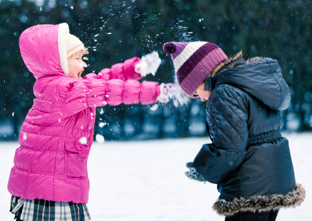istock Two Children in the Snow 155095355