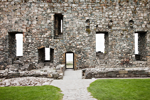 hole in wall of ruined old traditional building in Yorkshire, England, UK