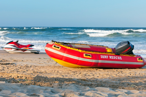 A lifeguard Rescue Dinghy raft and a wet bike, ready to reach out to sea.