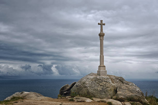 Stone cross in Finisterre on the Camino de Santiago, Galicia, Spain. These symbols were built since the XVII century to sanctify the roads and pilgrims who walk to Santiago.
