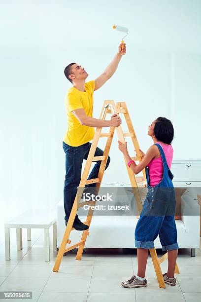 Young Couple Painting Apartment Stock Photo - Download Image Now - Moving House, African Ethnicity, Home Improvement