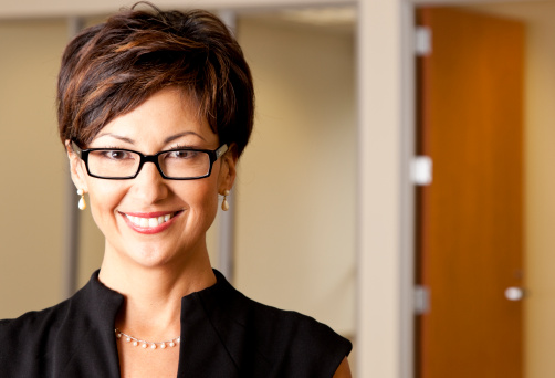 happy mixed race businesswoman wearing eye glasses, looking at camera