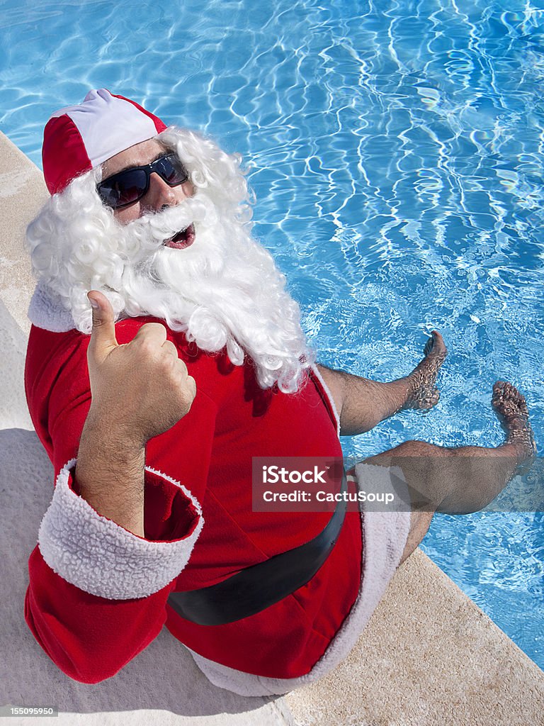 Santa Claus w basenie - Zbiór zdjęć royalty-free (Święty Mikołaj)