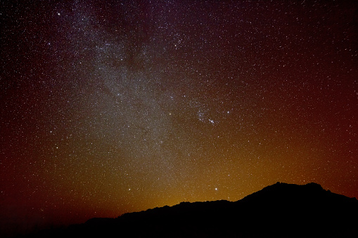 The milky way as wide angle shot above a mountain silhouette. Stacked from eight high ISO images taken in La Palma, Spain.