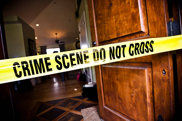 Crime Scene at Residential Home Crime Scene tape at the front door of a luxury home murder photos stock pictures, royalty-free photos & images