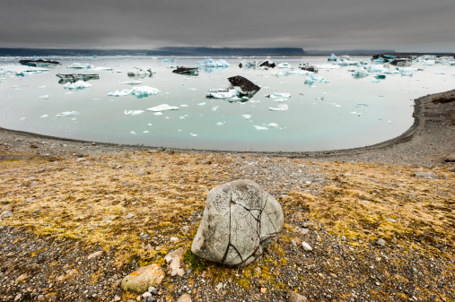 wide-angle shot of the famous icelandic glacial lake jökulsarlon, dramatic sky