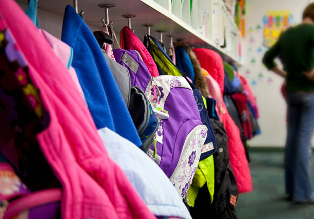 Elementary School Coat Rack: Backpacks  coat hook photos stock pictures, royalty-free photos & images
