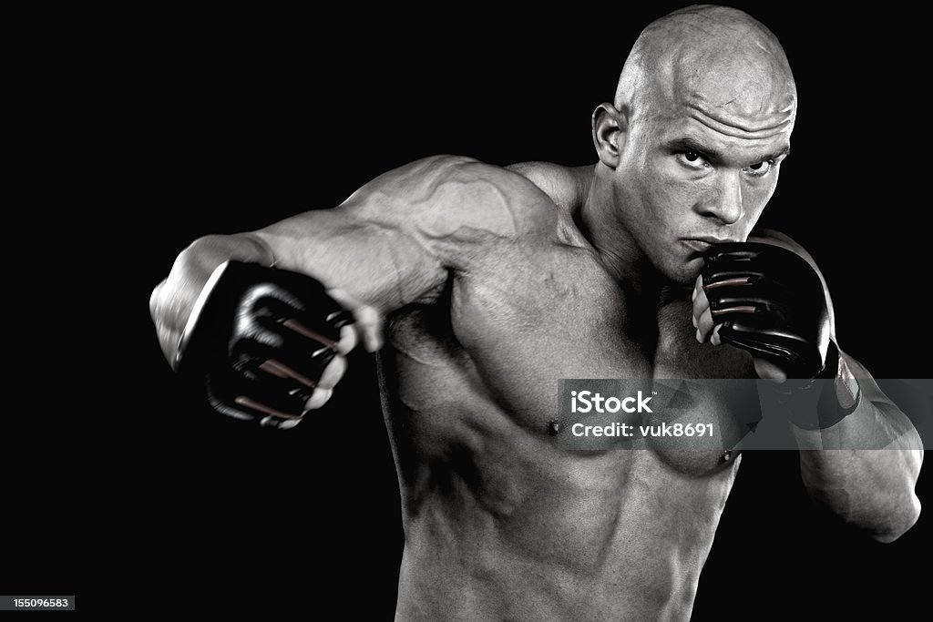 Potente fighter puñetazo - Foto de stock de Kick boxing libre de derechos