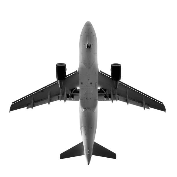 Airplane, view from directly below - isolated on white Airplane, view from directly below - black and white, isolated on white aeroplane isolated stock pictures, royalty-free photos & images