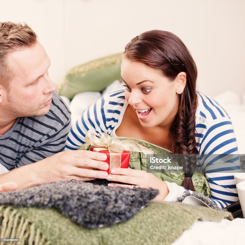 Getting a gift on christmas morning  30-34 Years Stock Photo