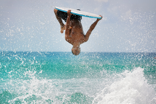 One of the best surfers on Maui doing a backflip. Nikon D3X. Converted from RAW.