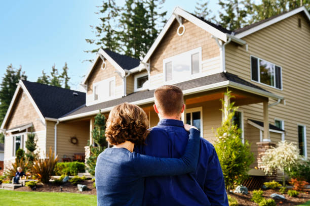 istock Family and their new home boy on step 155097314