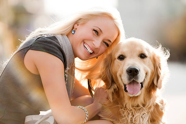 istock Smiling blonde female and her dog. 155097490