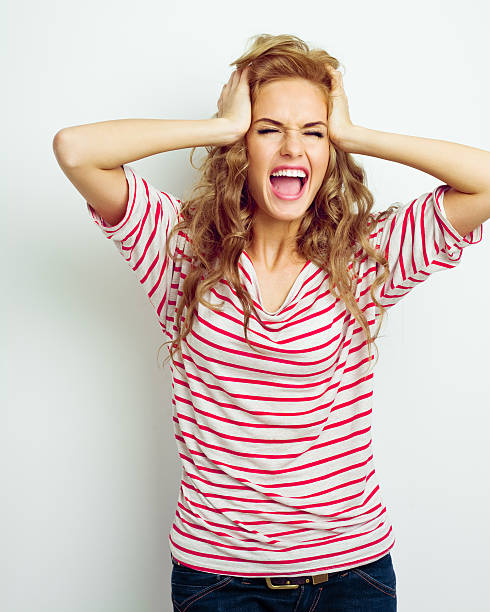 istock Young woman screaming 155097498