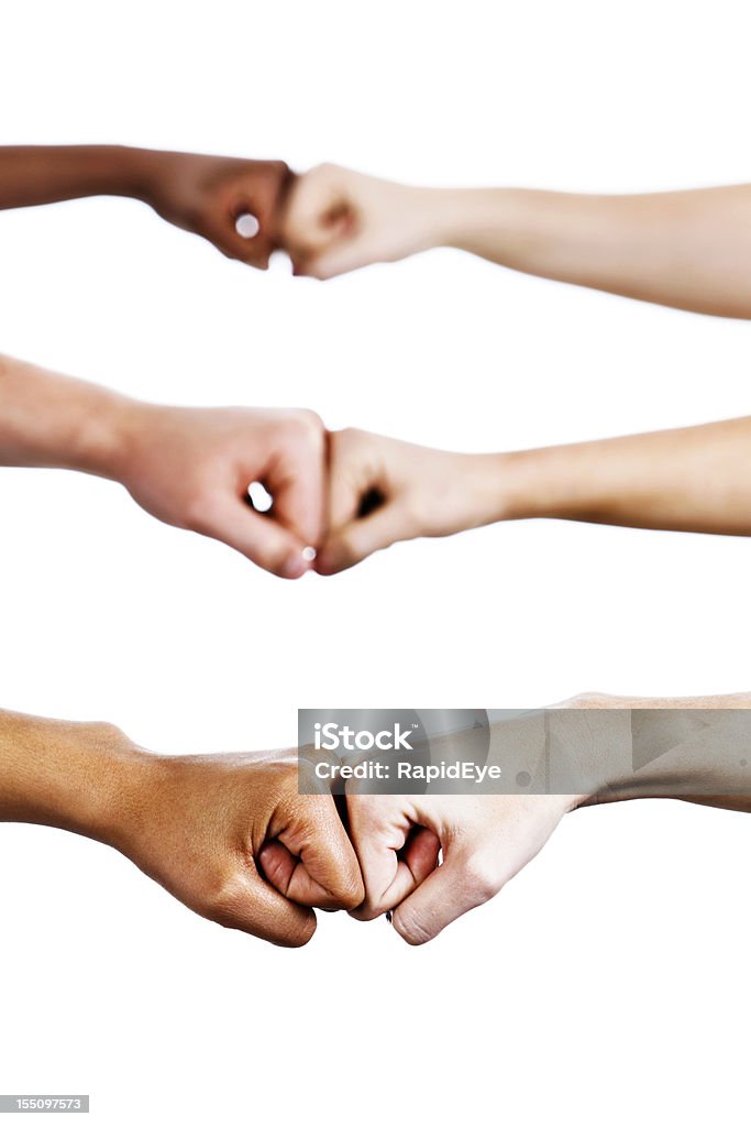 Three pairs of hands bump fists in agreement or greeting  Fist Bump Stock Photo