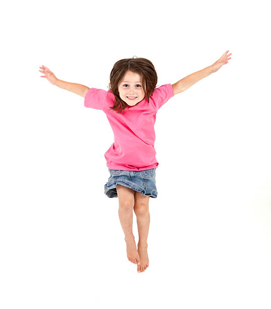 istock Little Girl Jumping on White Background 155097662