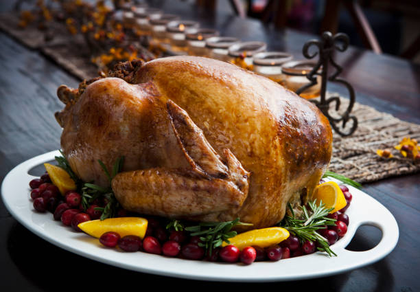 istock Roast turkey on a serving platter garnished with cranberries 155097668