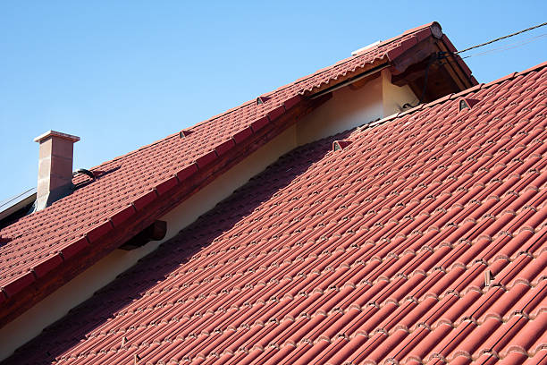 istock A red house roof on a sunny day 155097982