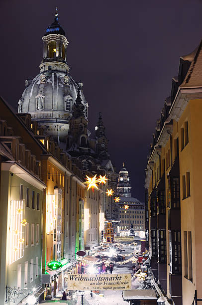 View on the Christmas market in the Münzgasse and at the Frauenkirche (Church of our Lady) in Dresden.