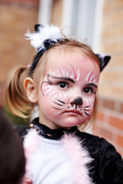 istock Young girl as face painted cat 155098158