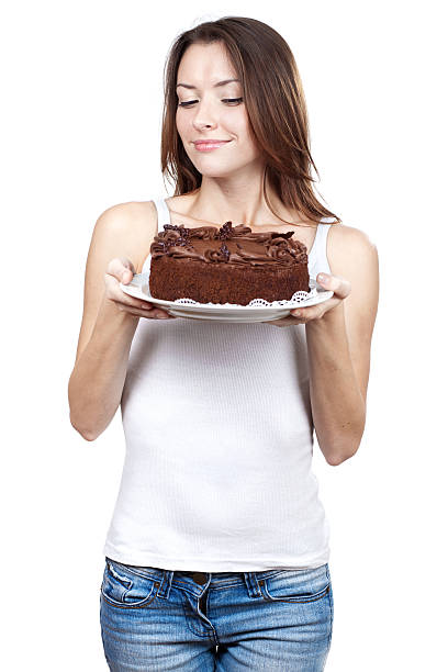 istock beautiful brunette woman holding chocolate cake 155098463