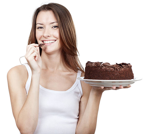 Girls having great fun digging into a cake. Vidiv crossprocessed colors.