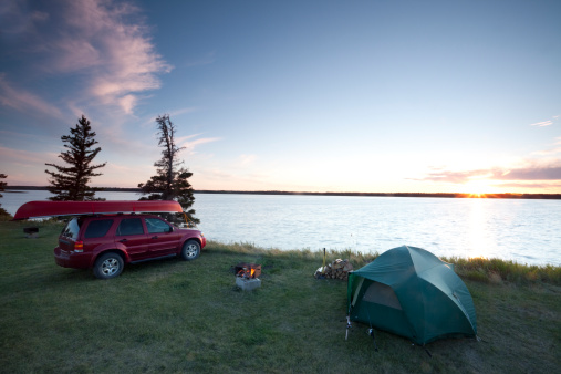 View of Lake Audy, Riding Mountain National park, Manitoba, Canada. Camping with a sunset.
