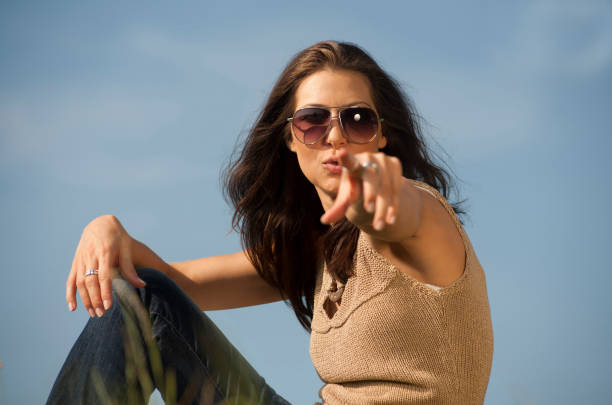 istock Beautiful woman is pointing on somebody 155098588