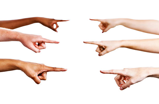 Six hands pointing: accusing, blaming or simply indicating someone Six mixed hands point across frame at each other, indicating, accusing or blaming. Isolated on white. blame stock pictures, royalty-free photos & images