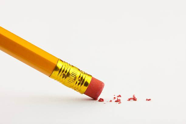 istock A pencil erasing on white paper 155098845