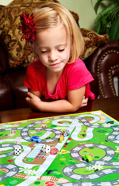 istock Preschool Girl Playing A Board Game 155098896
