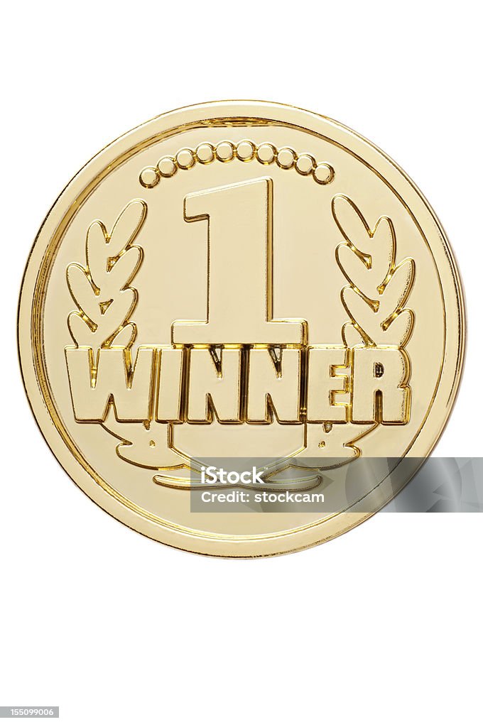 Isolated gold medal with number 1 winner A gold medal with the word "winner", isolated on white. Gold Medal Stock Photo